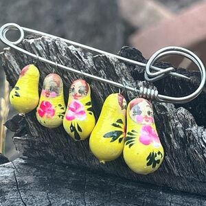 VINTAGE Yelloww Russian nesting doll safety pin brooch